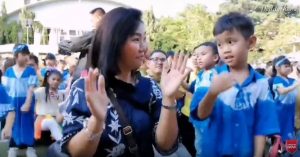 The impression the mother and children dance together on the school festival day